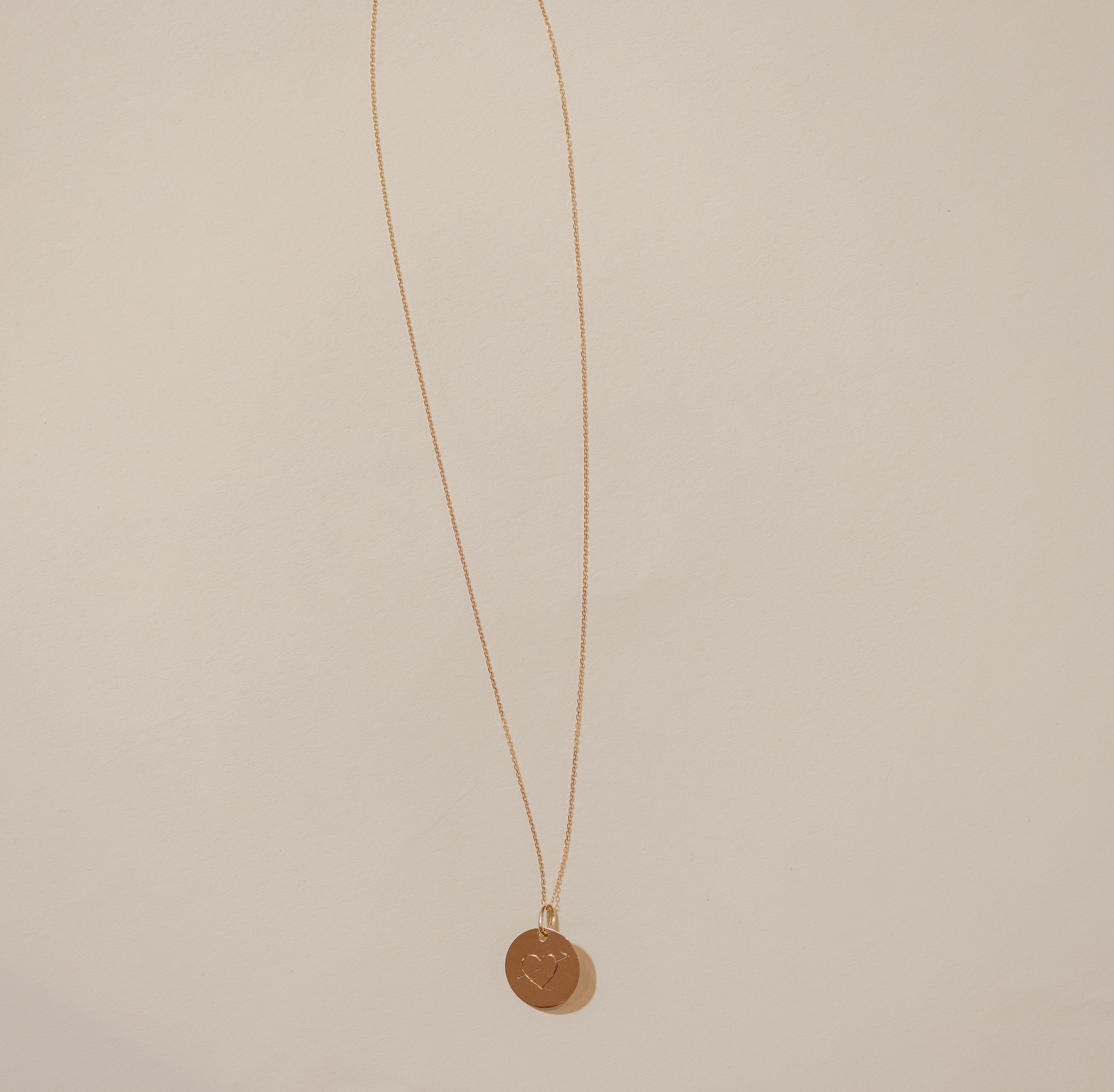 Customizable arrowed heart necklace